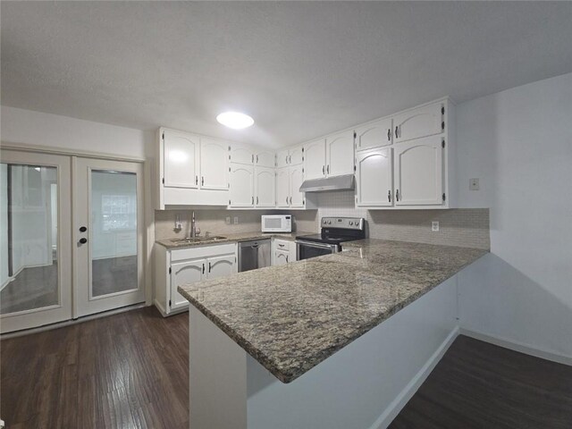 2821 NE Meadowlark Trl, Duluth, GA 30096 - kitchen featuring range with electric cooktop, under cabinet range hood, white microwave, dishwasher, and dark wood-style flooring