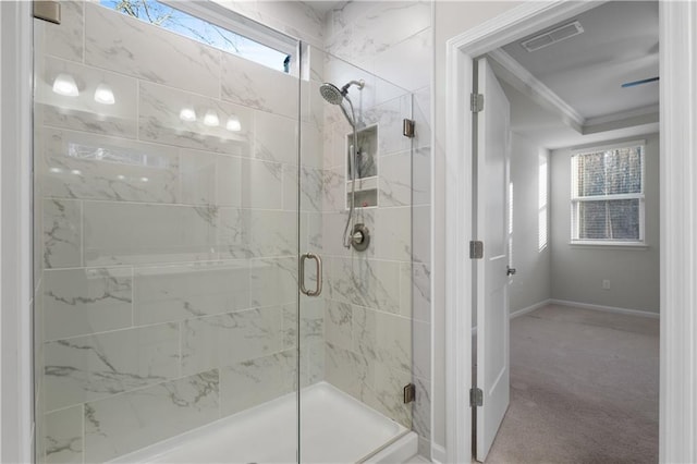 full bath with crown molding, visible vents, baseboards, and a shower stall