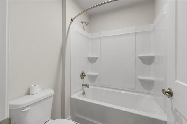 bathroom featuring toilet and shower / tub combination