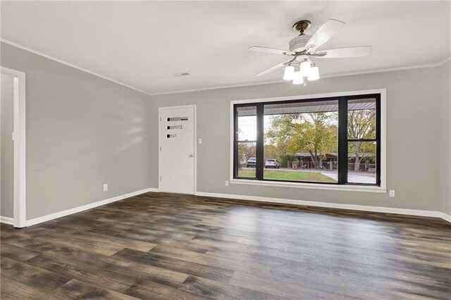 unfurnished living room with crown molding, ceiling fan, and dark wood-type flooring