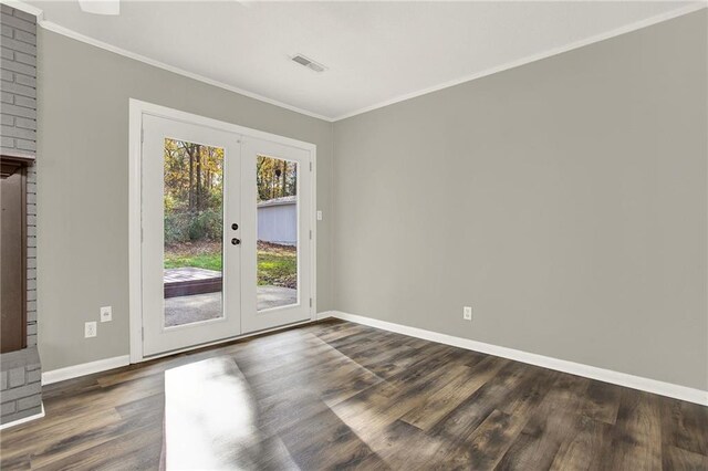 entryway featuring french doors, crown molding, and dark wood-type flooring