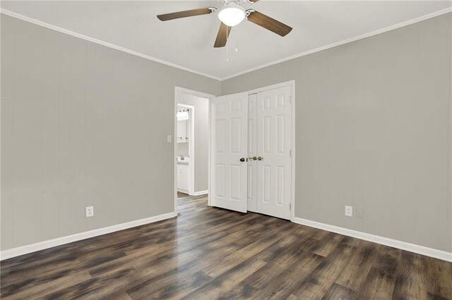 spare room featuring ceiling fan, dark hardwood / wood-style flooring, and ornamental molding