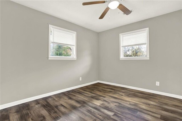 unfurnished room featuring dark hardwood / wood-style floors and ceiling fan