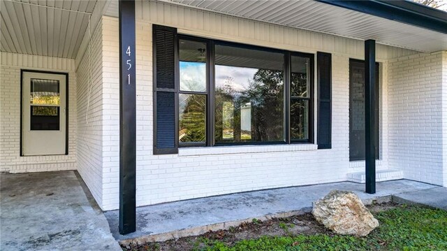 view of side of home featuring a porch