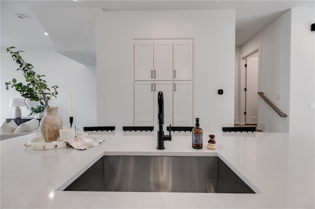 kitchen with white cabinets and sink