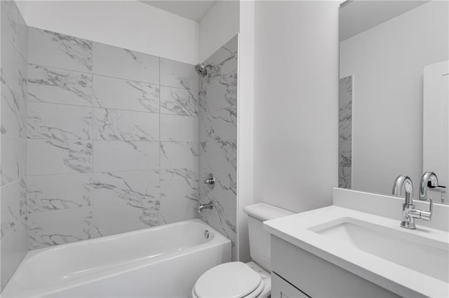 full bathroom featuring tiled shower / bath combo, toilet, and vanity