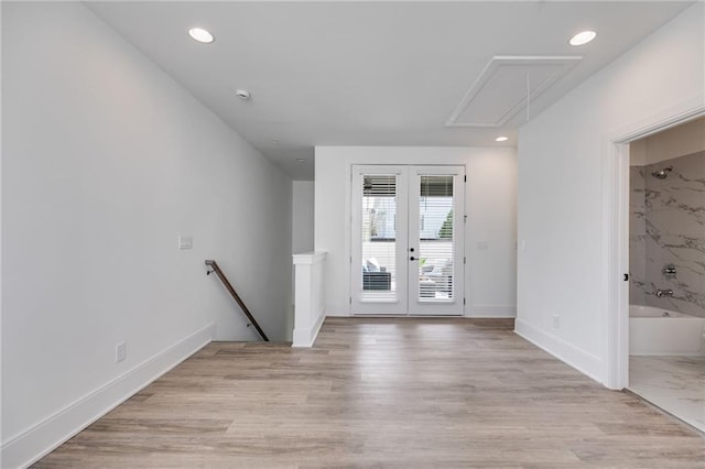 interior space featuring french doors and light hardwood / wood-style flooring