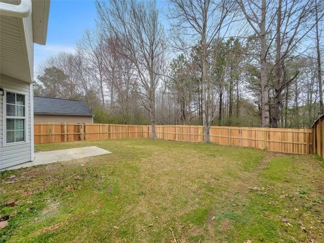 view of yard with a patio area and a fenced backyard