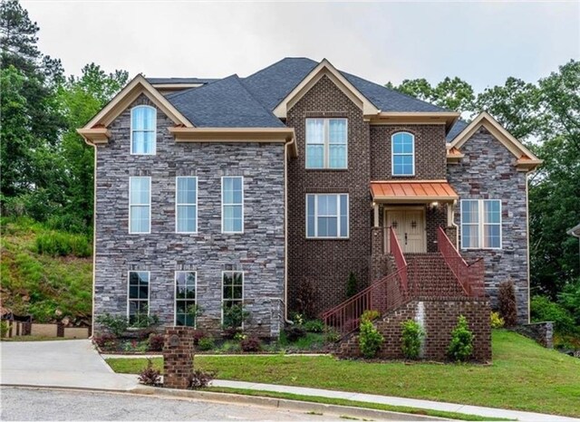 craftsman inspired home with a front yard