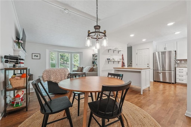 190 Windflower Trce, Roswell, GA 30075 - dining room featuring light wood-style flooring, stairs, ornamental molding, recessed lighting, and a chandelier