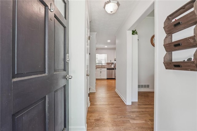 190 Windflower Trce, Roswell, GA 30075 - hallway with light wood-style floors and recessed lighting
