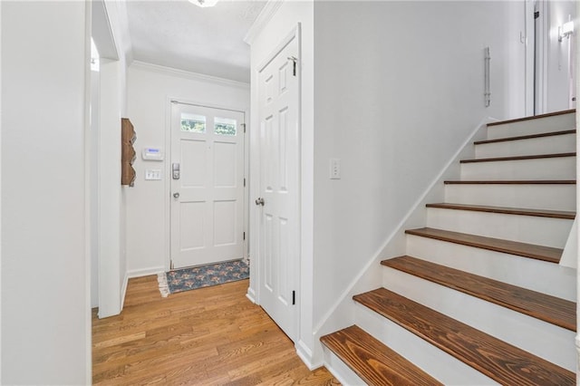 190 Windflower Trce, Roswell, GA 30075 - foyer featuring light wood-style flooring, crown molding, and stairs