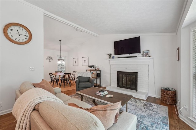 190 Windflower Trce, Roswell, GA 30075 - living room with wood finished floors, a fireplace, and a textured ceiling