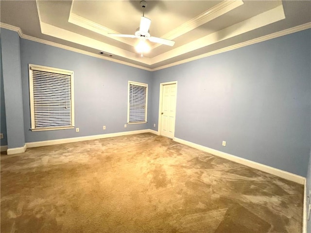 6745 Fairfield Trce, Suwanee, GA 30024 - carpeted empty room featuring a tray ceiling, crown molding, baseboards, and a ceiling fan