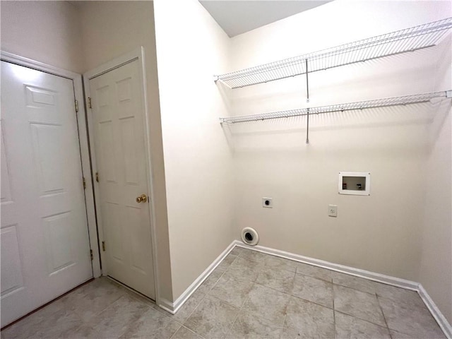 6745 Fairfield Trce, Suwanee, GA 30024 - laundry room featuring hookup for an electric dryer, washer hookup, baseboards, and light tile patterned floors