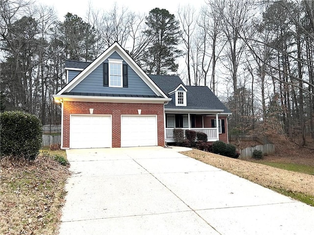6745 Fairfield Trce, Suwanee, GA 30024 - traditional-style home with covered porch, concrete driveway, brick siding, and a garage