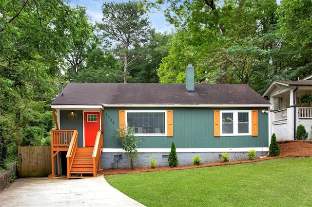 1258 Campbellton Rd SW, Atlanta, GA 30310 - view of front of home featuring crawl space, a chimney, view of wooded area, and driveway