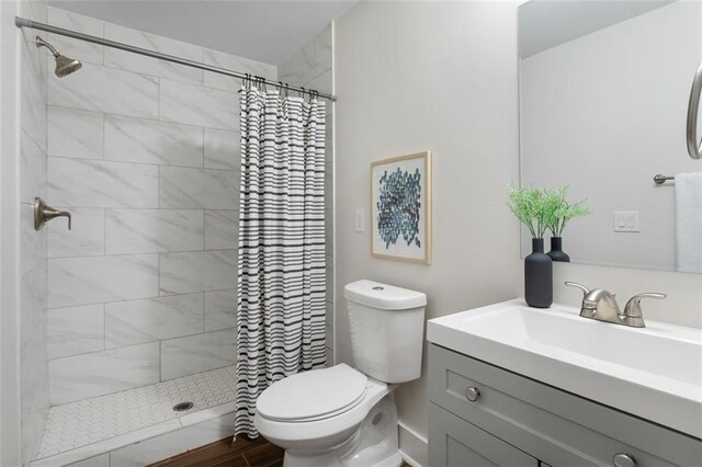 1258 Campbellton Rd SW, Atlanta, GA 30310 - full bath featuring vanity, a tile shower, and wood finished floors