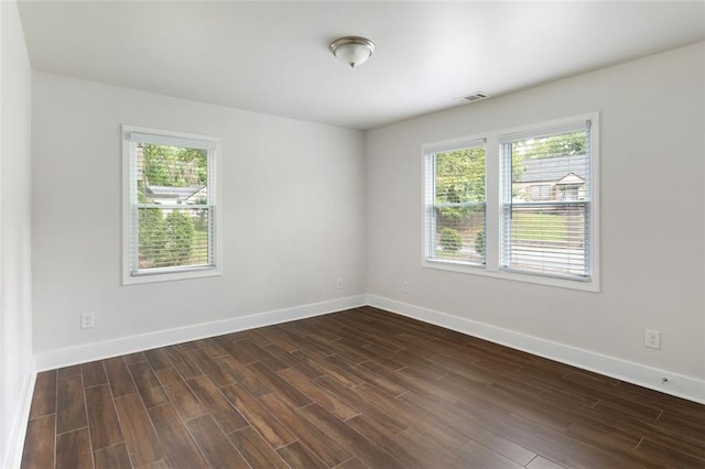 1258 Campbellton Rd SW, Atlanta, GA 30310 - empty room featuring healthy amount of natural light and dark wood finished floors
