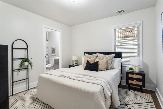 1258 Campbellton Rd SW, Atlanta, GA 30310 - bedroom featuring connected bathroom and wood finished floors