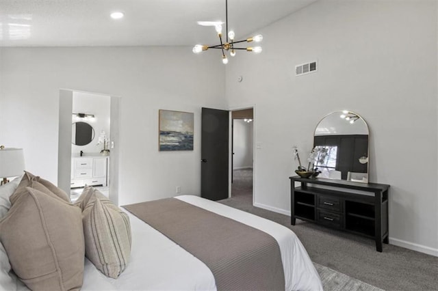 carpeted bedroom featuring baseboards, ensuite bath, visible vents, and an inviting chandelier