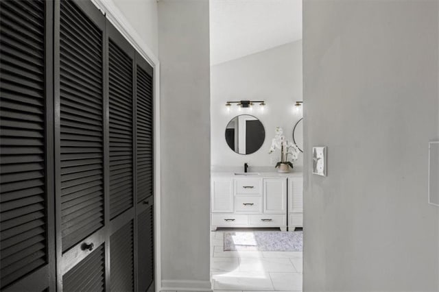 bathroom with a heating unit and vanity