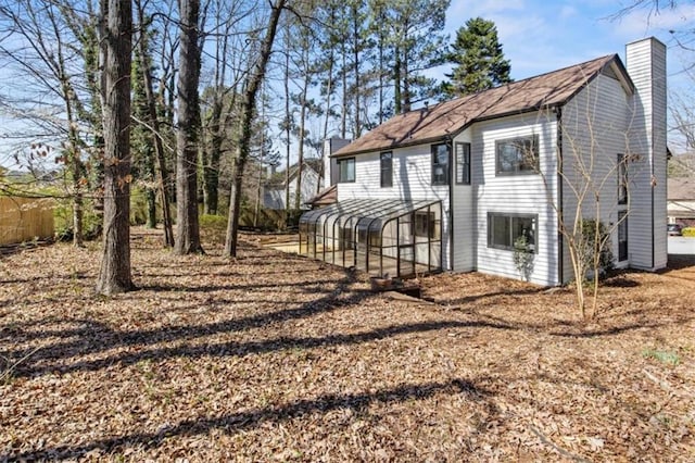 back of property featuring a chimney