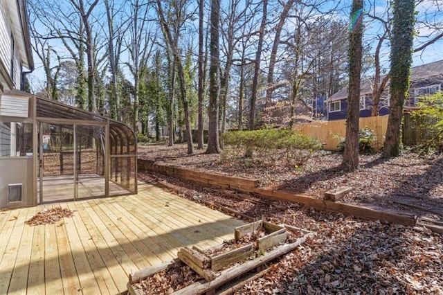 wooden deck featuring fence