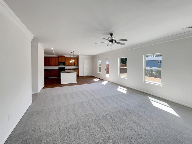 unfurnished living room featuring recessed lighting, visible vents, baseboards, and crown molding