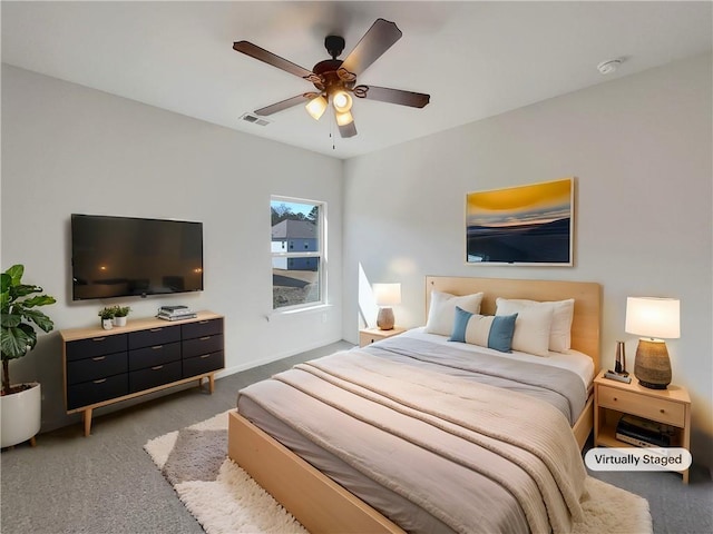 bedroom with light carpet, visible vents, and ceiling fan