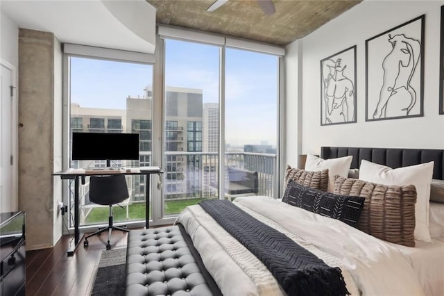 bedroom with wood finished floors, floor to ceiling windows, and ceiling fan