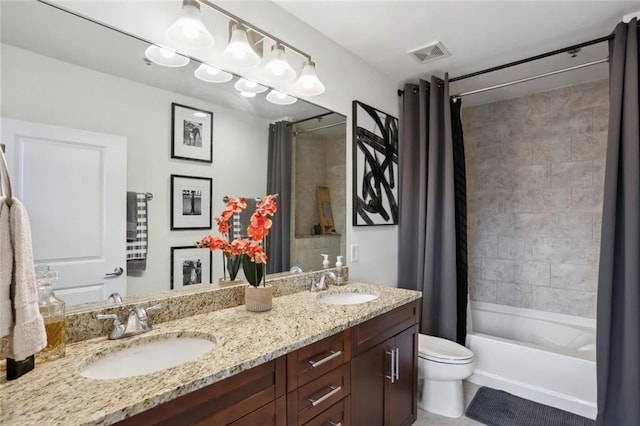 bathroom with toilet, double vanity, and shower / tub combo with curtain