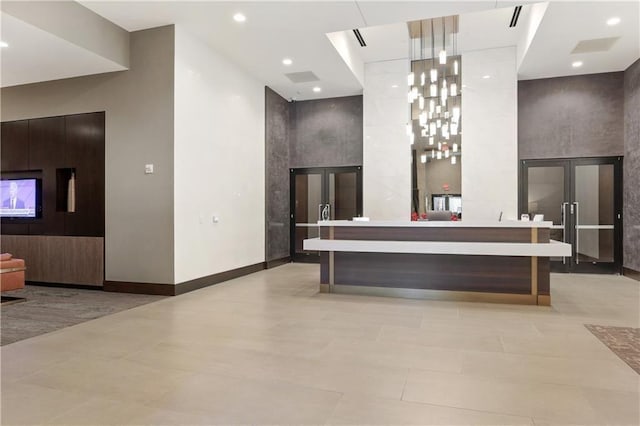 reception featuring french doors and recessed lighting