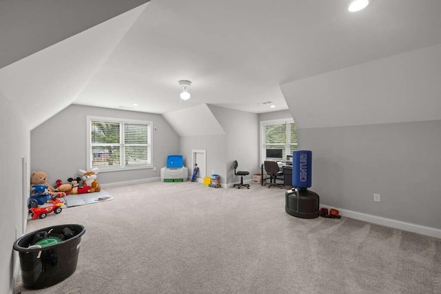 recreation room with carpet and lofted ceiling