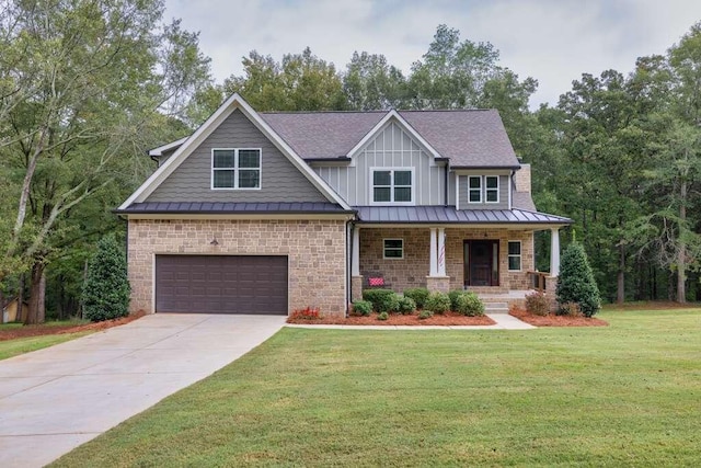 craftsman inspired home featuring a garage, a front yard, and covered porch