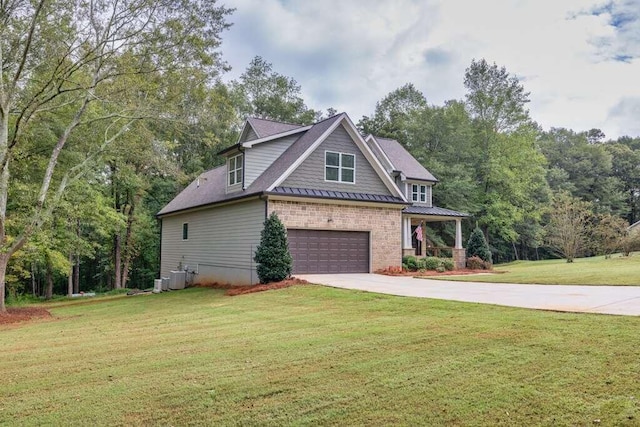 view of front of property with a garage and a front yard