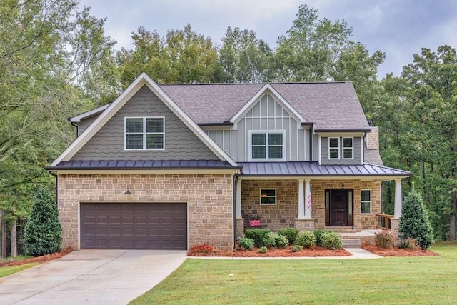 craftsman-style house with a front lawn, a garage, and covered porch