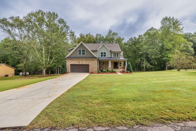 craftsman inspired home with a garage, a front yard, and a porch