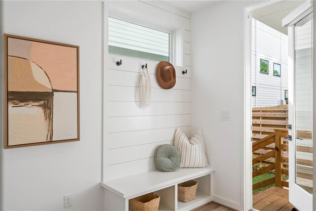 mudroom with baseboards and wood finished floors