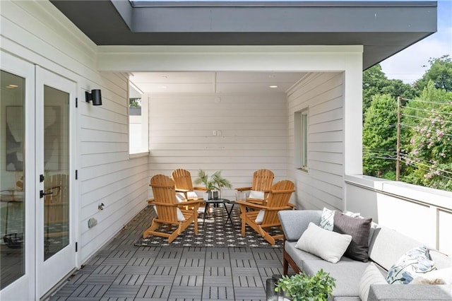 balcony featuring french doors