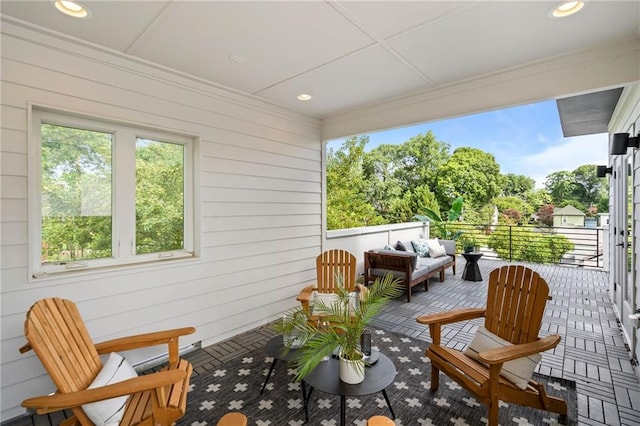 sunroom featuring an outdoor living space
