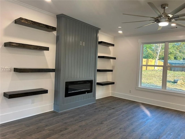 unfurnished living room featuring ceiling fan, ornamental molding, and dark hardwood / wood-style flooring