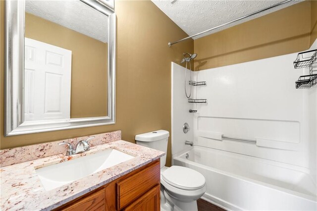 1382 Hollenbeck Ln, Riverdale, GA 30296 - full bathroom with a textured ceiling,  shower combination, and vanity