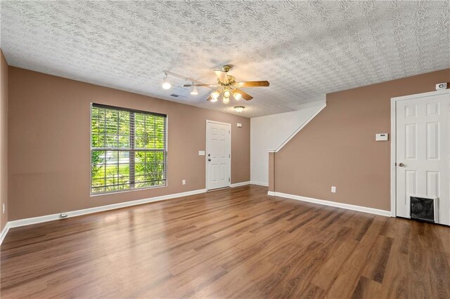 1382 Hollenbeck Ln, Riverdale, GA 30296 - unfurnished living room with wood finished floors and a ceiling fan