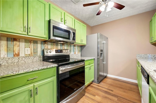 1382 Hollenbeck Ln, Riverdale, GA 30296 - kitchen with stainless steel appliances, green cabinetry, a textured ceiling, light wood-type flooring, and ceiling fan