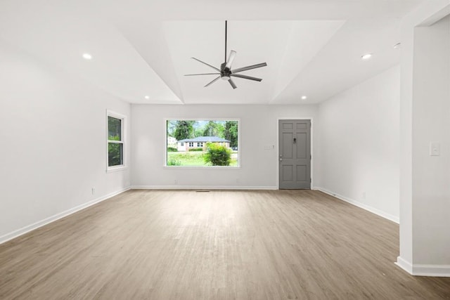 unfurnished living room featuring ceiling fan, recessed lighting, baseboards, wood finished floors, and vaulted ceiling