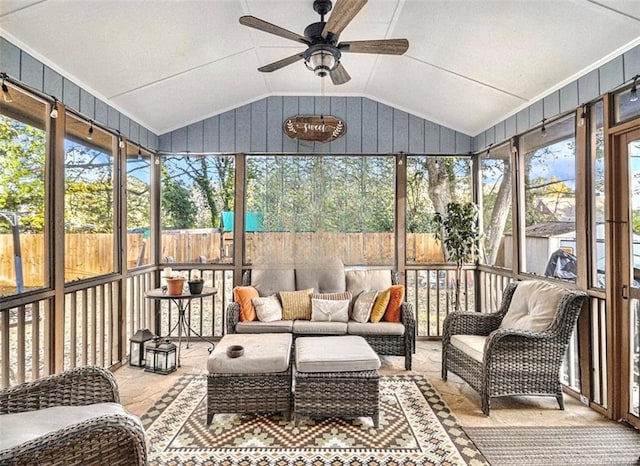 sunroom with lofted ceiling and ceiling fan