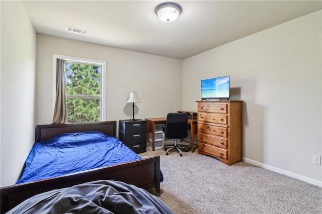 bedroom featuring baseboards, carpet flooring, and visible vents