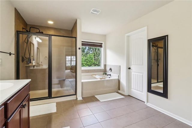 bathroom featuring visible vents, a garden tub, tile patterned flooring, vanity, and a stall shower