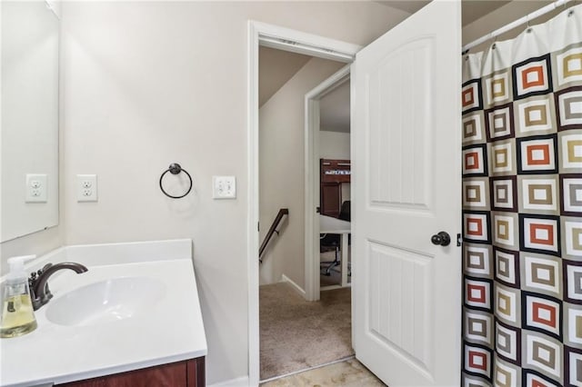 bathroom with a shower with shower curtain and vanity